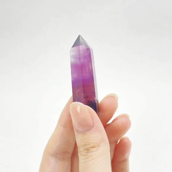 The Fluorite Mini Point is a crystal of clarity, insight, and inspired focus. Revered for its ability to organize thoughts and awaken intuition, it supports creative flow, mental discipline, and spiritual awareness. Its pointed form helps channel refined energy, making it ideal for learning, meditation, and moments requiring both imagination and precision.