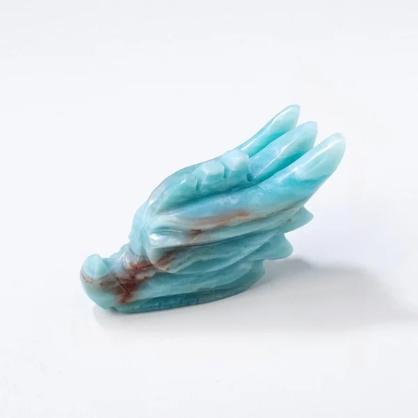 Bold and expressive, the Amazonite Dragon Head channels truth, courage, and transformational power. Hand-carved from soothing blue-green amazonite, it supports clear communication and emotional balance while symbolizing inner strength and renewal. This striking piece brings clarity, confidence, and purposeful energy into your space.