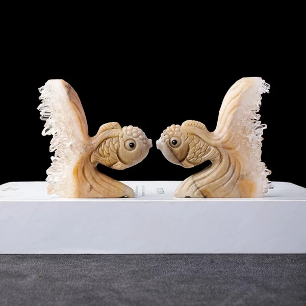 A symbolic Hand-Carved Clear Quartz Cluster Goldfish representing abundance, clarity, and spiritual protection. Crafted from natural clear quartz, this carving amplifies intention while harmonizing and grounding energy across all chakras.