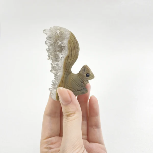 Playful yet powerful, the Clear Quartz Cluster Squirrel embodies spiritual awareness, grounding, and protective clarity. Hand-carved with a natural quartz cluster, this symbolic figure amplifies energy while anchoring it gently, making it a meaningful companion for intuitive growth and balanced protection in any sacred space.