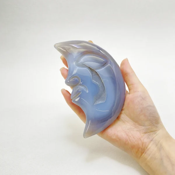 Mystical and serene, this Druzy Agate Moon invites deep intuition and gentle healing into your space. Hand-carved to reveal a tranquil lunar face and shimmering druzy core, it supports spiritual growth while offering calm reassurance during periods of recovery and inner renewal.