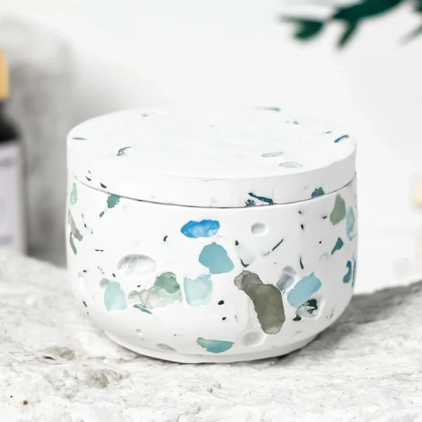 A tranquil Aquamarine Candle Holder adorned with crushed aquamarine crystals and paired with a Blue Wind Chimes scented soy candle. This handcrafted piece blends oceanic mineral tones with airy, refreshing fragrance, creating a serene coastal ambiance for relaxation, clarity, and refined home décor.