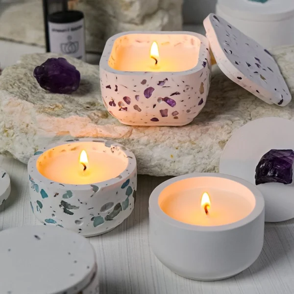 A tranquil Aquamarine Candle Holder adorned with crushed aquamarine crystals and paired with a Blue Wind Chimes scented soy candle. This handcrafted piece blends oceanic mineral tones with airy, refreshing fragrance, creating a serene coastal ambiance for relaxation, clarity, and refined home décor.